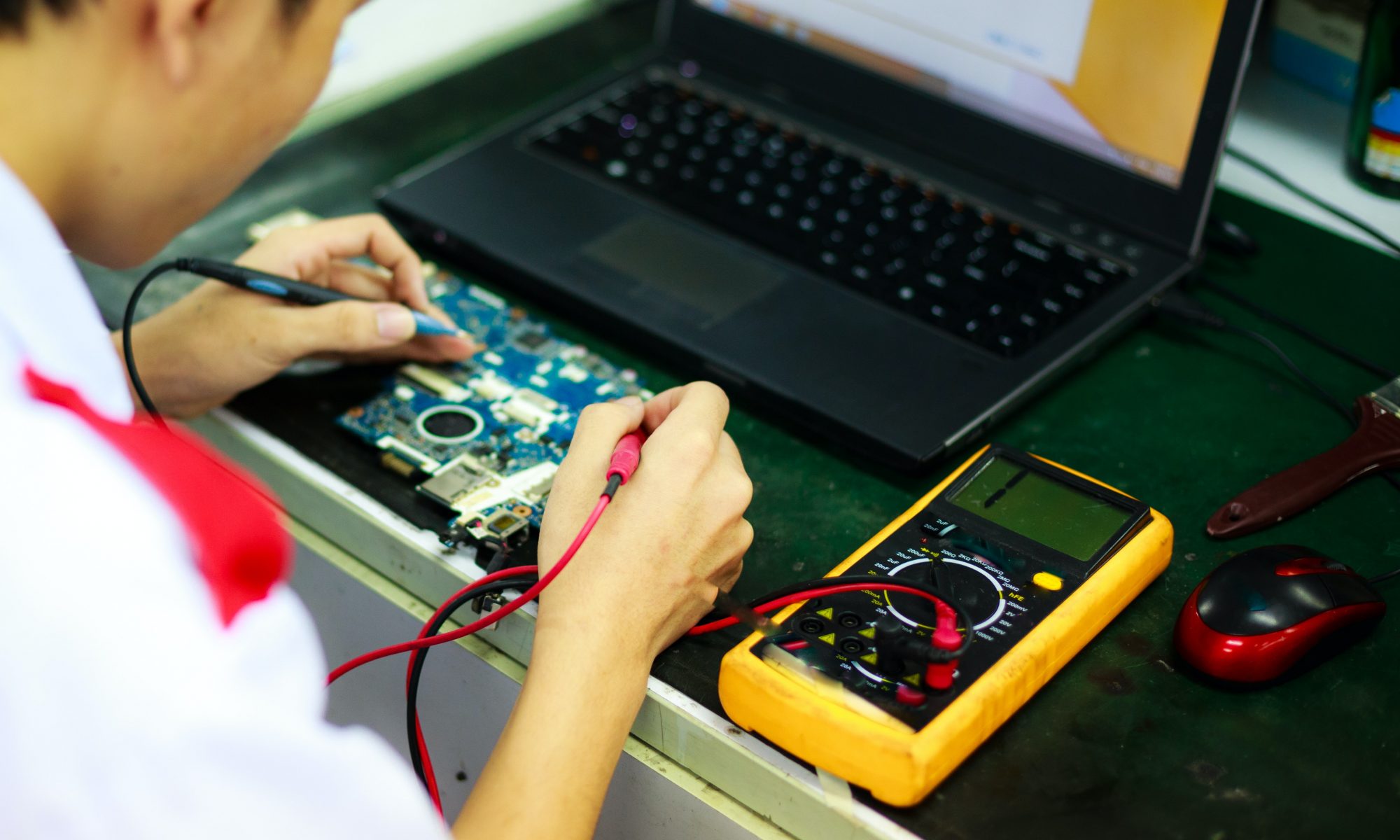 Man soldering circuit board