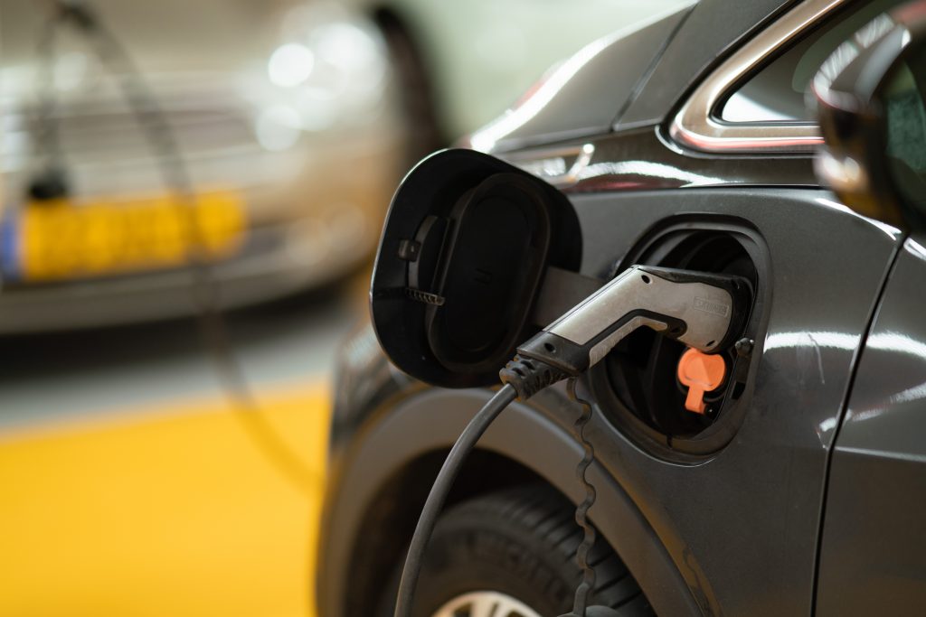 Closeup of cable charging an electric car