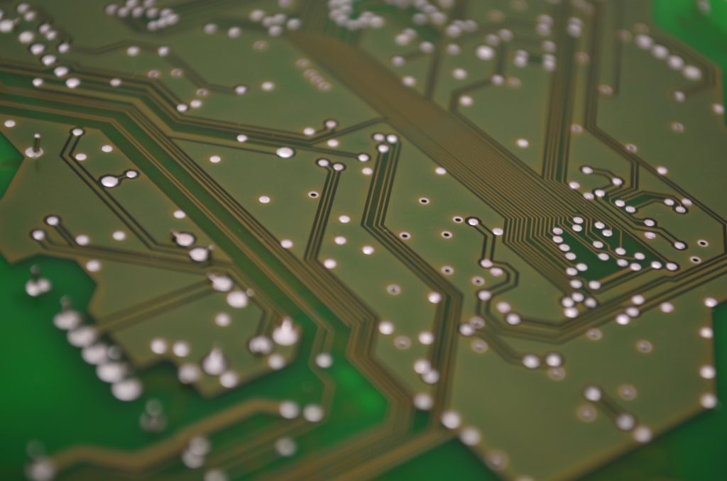 Extreme closeup of green circuit board