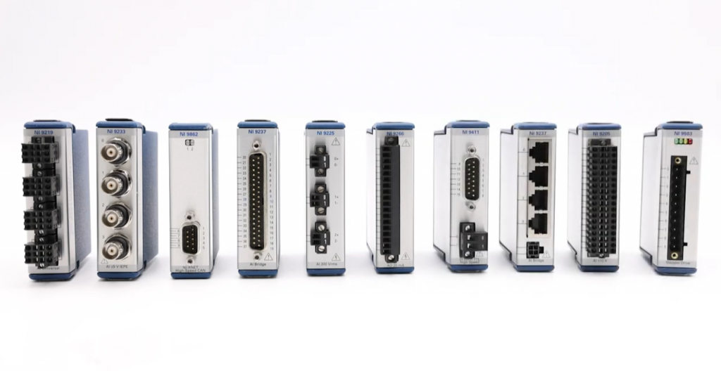 various C series modules from NI in a row with a white background