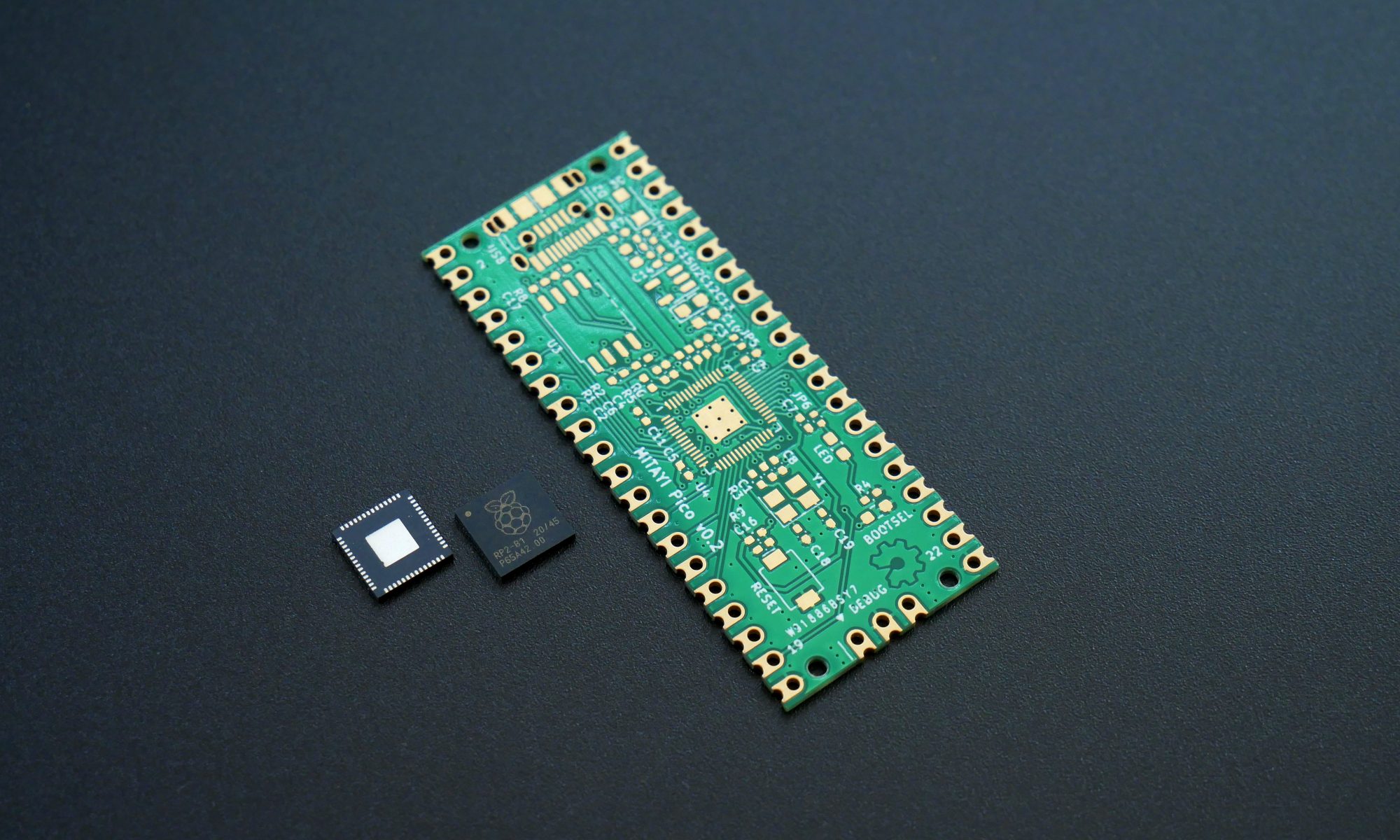 A plain Mitayi Pico RP2040 PCB near to two RP2040 microcontrollers.