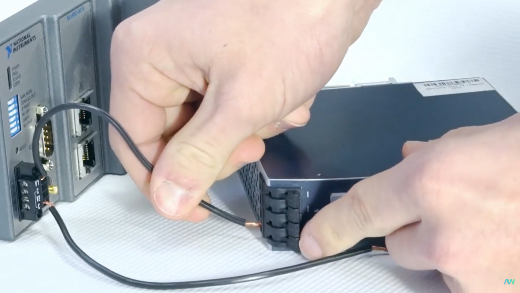 Closeup of a technician at Apex Waves repairing a NI product