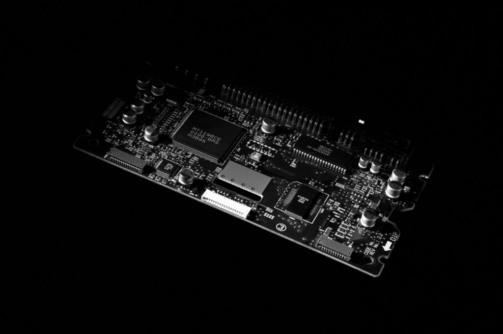 PCB board with chip on black background