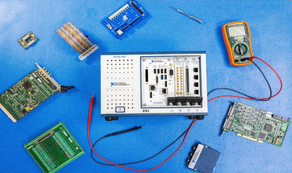 Assorted National Instruments Technology for a test system on a blue background