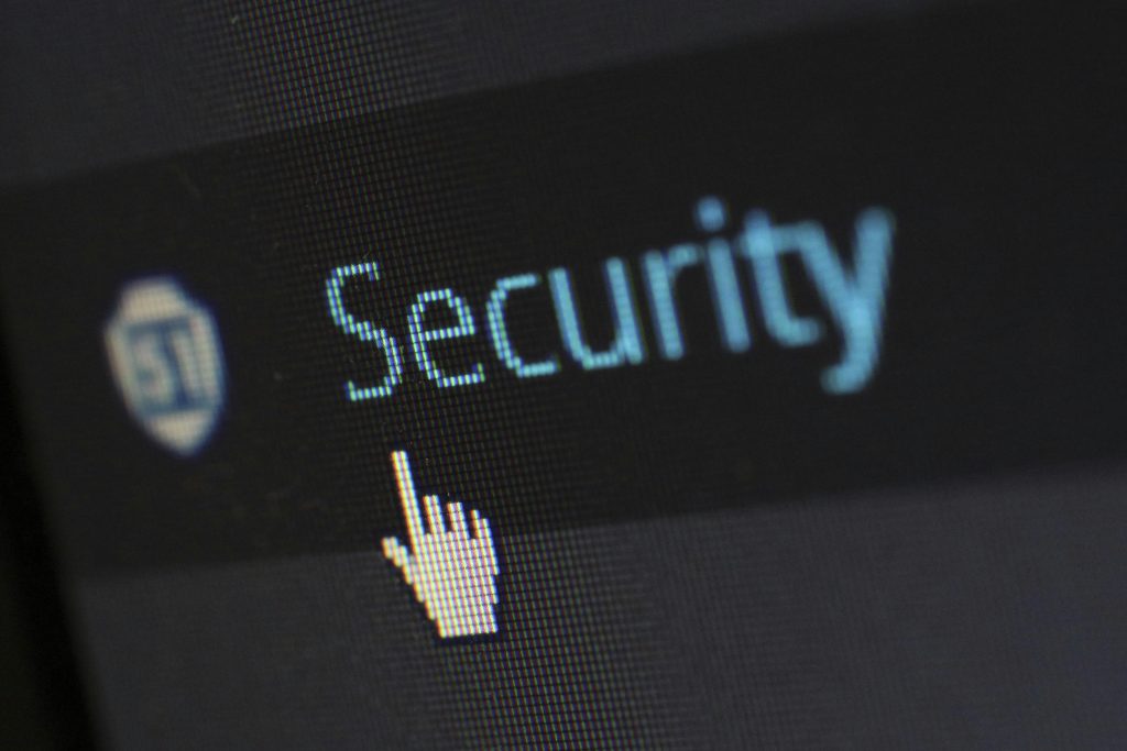 Computer cursor hovering over the word security