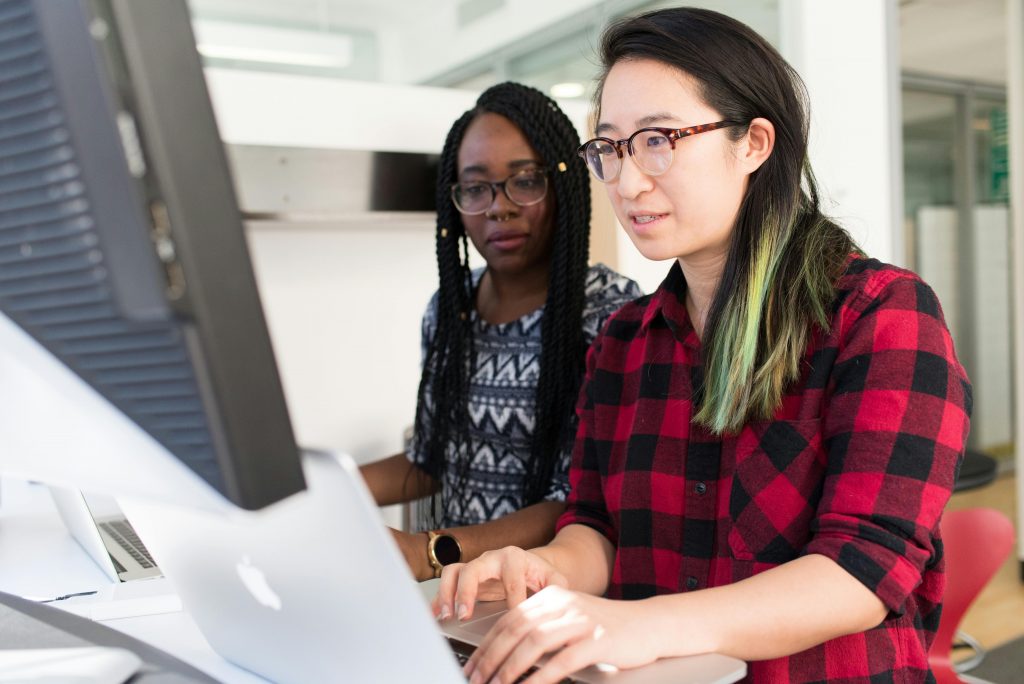 Women using a macbook computer