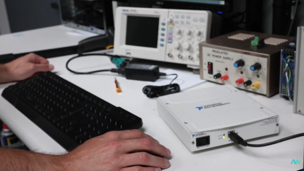 Closeup of technician's test bench with hardware plugged in