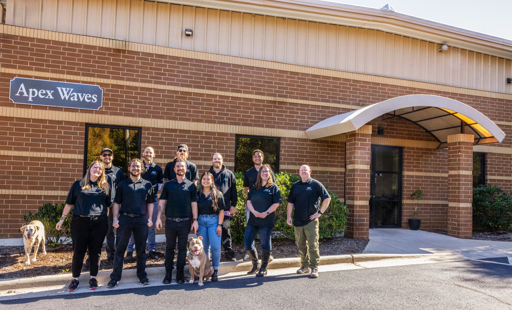 Apex Waves team in front of their new building