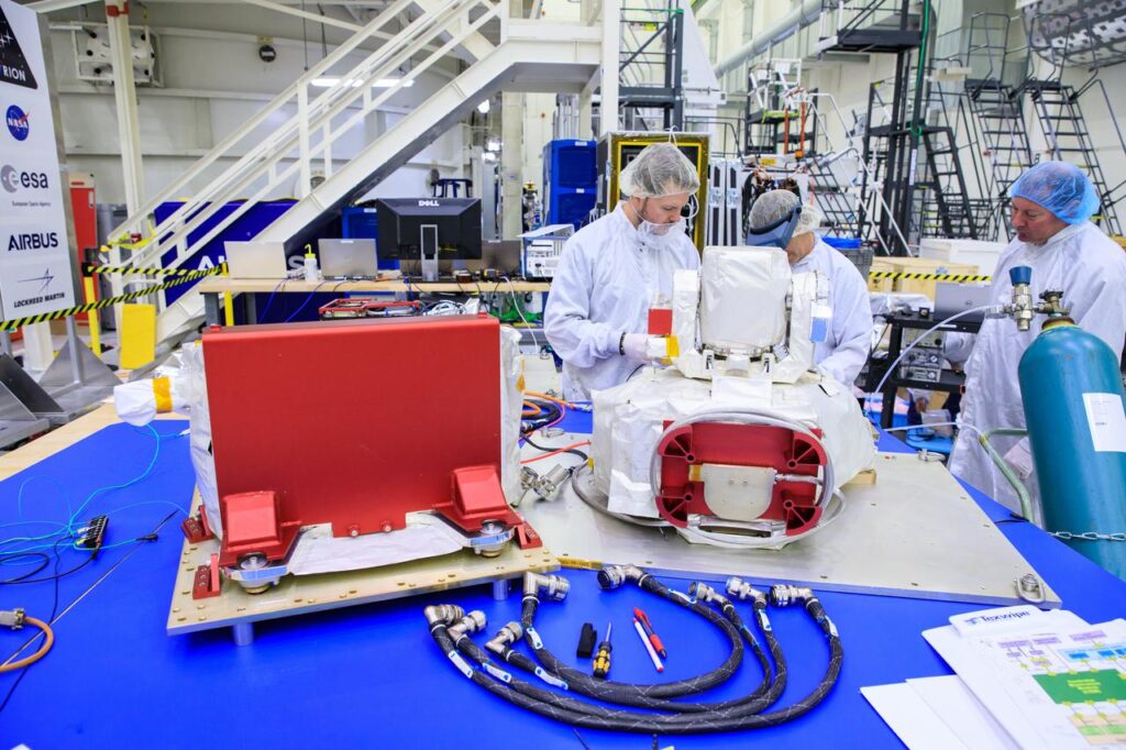 NASA engineers working on the Optical Communications System that will be used by the Artemis II