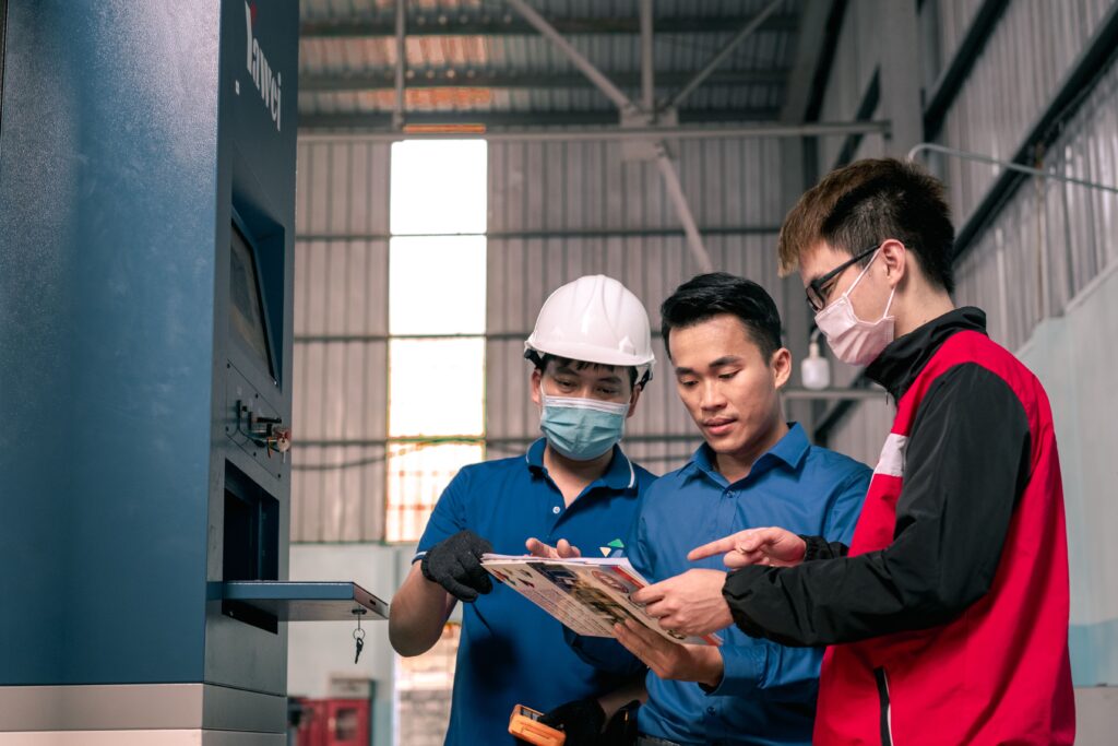 Engineers working on a system workflow